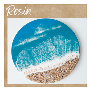 Round resin art that looks like the ocean shore